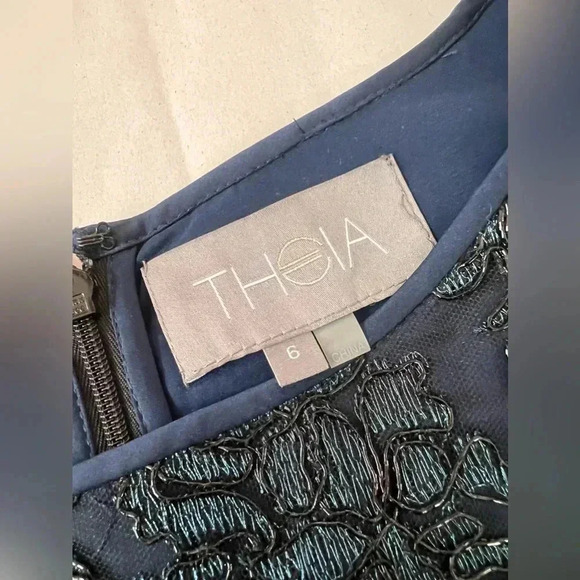 Theia Blue Party Dresss with Metallic Embroidered Black Net Overlay Bell Sleeve - Picture 10 of 13